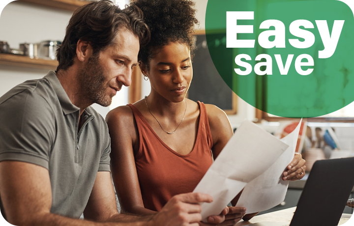 A couple reviewing an IRA plan to save money for the future.
