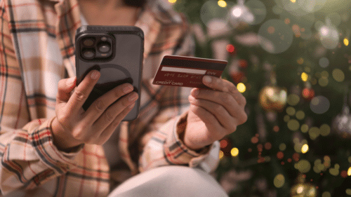 Merry and Mindful Holiday Shopping Webinar. Person on smart phone shopping with credit card.